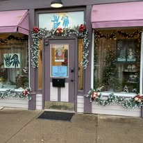 Hands On Health storefront on Genesee Street in Greene, NY with holiday decorations