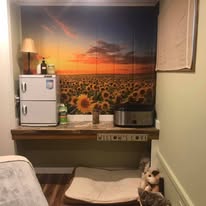 Treatment room supplies showing massage oils, towels, and therapeutic tools at Hands On Health